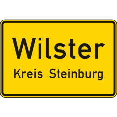 Ortstafel Vorderseite Verkehrsschild VZ 310 Wilster Kreis Steinburg gelbes Schild mit schwarzem Rand und schwarzer Schrift