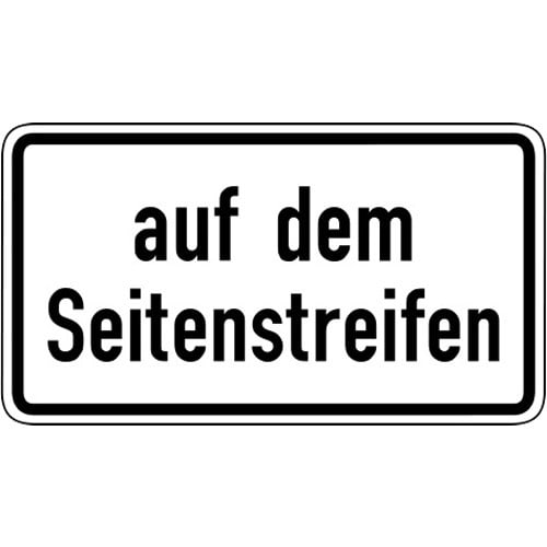 Verkehrsschild Auf dem Seitenstreifen VZ 1053-34 weißes rechteckiges Schild mit schwarzem Rand und schwarzer Aufschrift