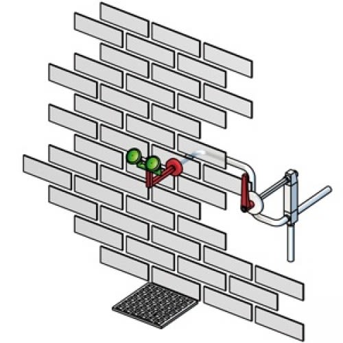Frostsichere Augendusche mit manueller Betätigung und Wandmontage, grüne Augenduschen an rotem Halter, montiert an einer Ziegelwand mit Ablaufgitter darunter
