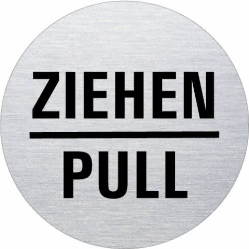 Rundes Textschild aus Metall mit der Aufschrift Ziehen und Pull in schwarzer Schrift