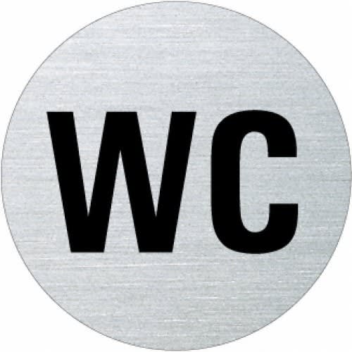 Rundes Textschild mit der Aufschrift WC in schwarzer Schrift auf silbernem Hintergrund