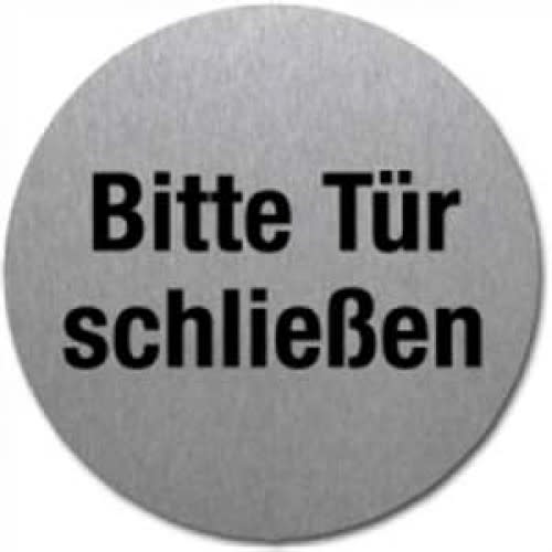 Rundes Textschild mit der Aufschrift Bitte Tür schließen in schwarzer Schrift auf grauem Hintergrund