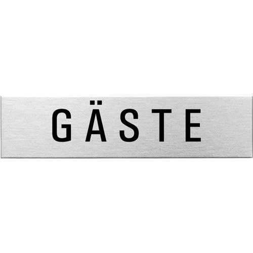 Eckiges Textschild mit dem Schriftzug Gäste in schwarzer Schrift auf silbernem Hintergrund