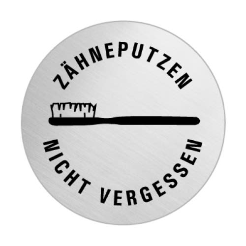 Rundes Metallschild mit schwarzem Symbol einer Zahnbürste und dem Text Zähneputzen nicht vergessen