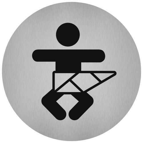 Rundes Piktogramm aus Edelstahl mit Symbol für Wickelraum, stilisierte Figur mit Wickeltisch