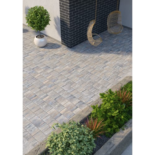 Betonpflasterstein Kaiser Finesse verlegt auf Terrasse mit Pflanzen und Hängesesseln