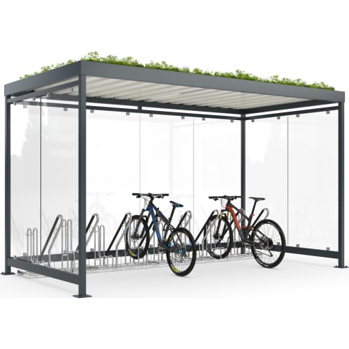 Fahrradüberdachung Köln Bike Professional Plus K4 b/b mit zwei Mountainbikes und Fahrradständer unter modernem, begrüntem Dach