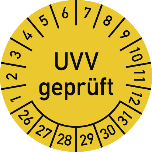 Runde Prüfplakette mit der Aufschrift UVV geprüft in Schwarz auf gelbem Hintergrund, mit Zahlen von 1 bis 12 und 26 bis 31 am Rand