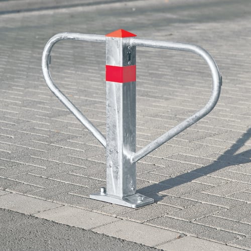 Durchgangssperre Merkur mit Spitzkopf aus Metall mit rotem Streifen auf gepflastertem Boden