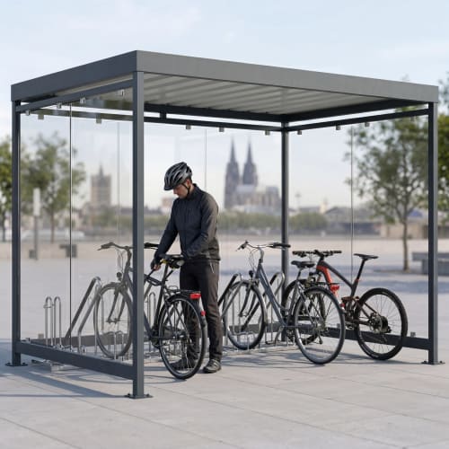 Fahrradüberdachung Köln Bike Economy K3 b/b mit mehreren Fahrrädern und Person mit Helm