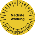 Prüfplakette für nächste Wartung mit Monats- und Jahresangaben
