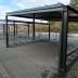 Wand-Fahrradständer Maren aus Metall mit überdachtem Fahrradparkplatz im Außenbereich