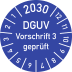 Blaue Prüfplakette mit Aufschrift DGUV Vorschrift 3 geprüft und Jahresangabe 2030