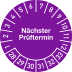 Prüfplakette lila mit Aufschrift Nächster Prüftermin und Monatszahlen von 1 bis 12 sowie Jahreszahlen von 28 bis 33