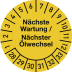 Gelbe Prüfplakette mit der Aufschrift Nächste Wartung / Nächster Ölwechsel und Zahlen von 1 bis 33