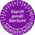 Prüfplakette mit der Aufschrift Geprüft gemäß BetrSichV in lila mit Zahlenring von 1 bis 12 und 28 bis 33