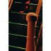 tesa® Antirutschklebeband 60953 auf dunkler Treppe mit grünen Leuchtstreifen und rotem Schuh